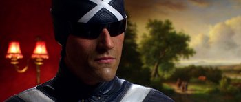 Movie still from “Speed Racer” (2008), directed by Lilly Wachowski – A person wearing a helmet and sunglasses; Close Up shot, Low angle