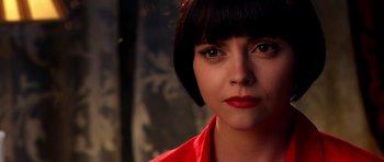 Movie still from “Speed Racer” (2008), directed by Lilly Wachowski – A person with short hair; Close Up shot, Over the shoulder angle