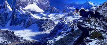 Movie still from “Speed Racer” (2008), directed by Lilly Wachowski – A view of a snowy mountain from a helicopter; Extreme Wide shot, High angle