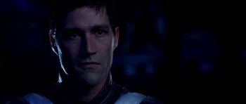 Movie still from “Speed Racer” (2008), directed by Lilly Wachowski – A man's face in the dark; Close Up shot, Over the shoulder angle