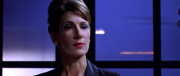 Movie still from “Speed Racer” (2008), directed by Lilly Wachowski – A person wearing a suit; Close Up shot, Over the shoulder angle