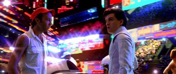 Movie still from “Speed Racer” (2008), directed by Lilly Wachowski – A young man standing in front of neon lights; Close Up shot, Low angle