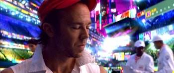 Movie still from “Speed Racer” (2008), directed by Lilly Wachowski – A person wearing a red hat; Close Up shot, Low angle