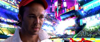 Movie still from “Speed Racer” (2008), directed by Lilly Wachowski – A person wearing a hat; Close Up shot, Low angle