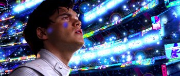 Movie still from “Speed Racer” (2008), directed by Lilly Wachowski – A man looking up into the sky at a stadium; Close Up shot, Low angle