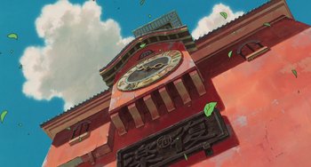 Movie still from “Spirited Away” (2001), directed by Hayao Miyazaki – A painting of a clock on the side of a building; Extreme Wide shot, Low angle