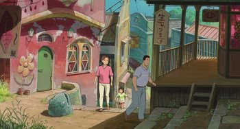 Movie still from “Spirited Away” (2001), directed by Hayao Miyazaki – An animated scene of a man , woman , and a child walking down a street; Extreme Wide shot, High angle