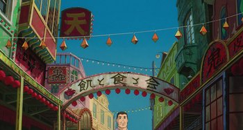 Movie still from “Spirited Away” (2001), directed by Hayao Miyazaki – An asian street scene with an asian character on the sign; Extreme Wide shot, Low angle