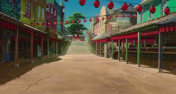 Movie still from “Spirited Away” (2001), directed by Hayao Miyazaki – An empty street with red lanterns hanging from the ceiling; Extreme Wide shot, High angle