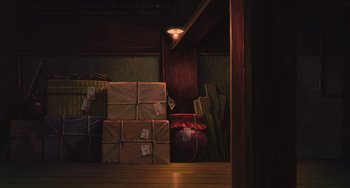 Movie still from “Spirited Away” (2001), directed by Hayao Miyazaki – A bunch of boxes are stacked on top of each other; Extreme Wide shot, Low angle