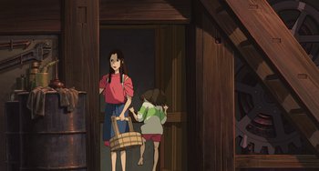 Movie still from “Spirited Away” (2001), directed by Hayao Miyazaki – A woman holding a basket while a child walks by; Wide shot, High angle