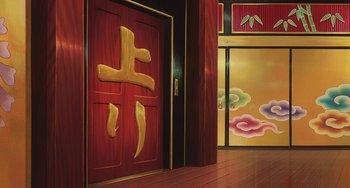 Movie still from “Spirited Away” (2001), directed by Hayao Miyazaki – A doorway with a red door and a red door with a gold and yellow design; Extreme Wide shot, Low angle