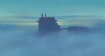 Movie still from “Spirited Away” (2001), directed by Hayao Miyazaki – A house in the middle of the fog; Extreme Wide shot, Low angle