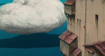 Movie still from “Spirited Away” (2001), directed by Hayao Miyazaki – An illustration of a building and a cloud in the sky; Extreme Wide shot, Low angle