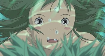 Movie still from “Spirited Away” (2001), directed by Hayao Miyazaki – An anime character is looking up at the sky; Close Up shot, Overhead angle