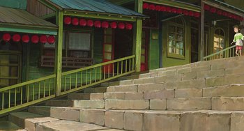 Movie still from “Spirited Away” (2001), directed by Hayao Miyazaki – A painting of a green house with steps leading up to it; Extreme Wide shot, Low angle