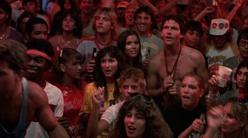 Movie still from “Spring Break” (1983), directed by Sean S. Cunningham – A group of young people standing in front of each other; Medium shot, Low angle