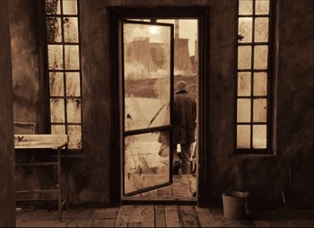 Movie still from “Stalker” (1979), directed by Andrei Tarkovsky – An old photo of a man standing in front of an open door; Wide shot, High angle