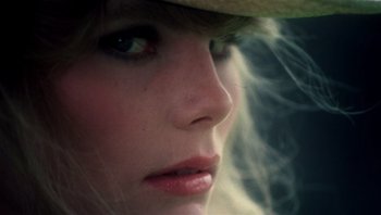 Movie still from “Star 80” (1983), directed by Bob Fosse – A woman's face wearing a hat; Close Up shot, Low angle