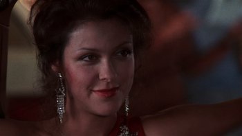 Movie still from “Star 80” (1983), directed by Bob Fosse – A person wearing a red dress; Close Up shot, Over the shoulder angle