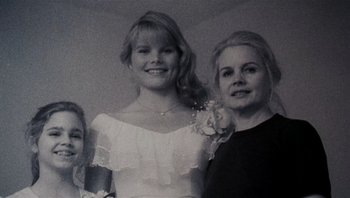 Movie still from “Star 80” (1983), directed by Bob Fosse – A black and white photo of two women and a little girl; Close Up shot, Low angle