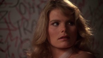 Movie still from “Star 80” (1983), directed by Bob Fosse – A person with long blonde hair; Close Up shot, Over the shoulder angle