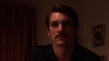 Movie still from “Star 80” (1983), directed by Bob Fosse – A person with a mustache; Close Up shot, Low angle