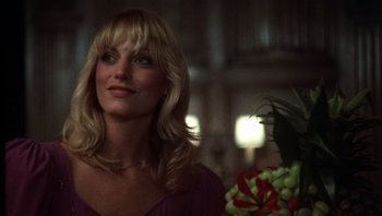 Movie still from “Star 80” (1983), directed by Bob Fosse – A woman in a purple top looking to her left; Close Up shot, Low angle