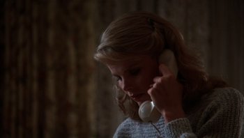 Movie still from “Star 80” (1983), directed by Bob Fosse – A young woman is talking on a phone; Close Up shot, High angle
