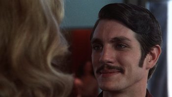Movie still from “Star 80” (1983), directed by Bob Fosse – A person with a mustache; Close Up shot, Low angle