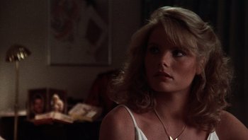 Movie still from “Star 80” (1983), directed by Bob Fosse – A woman with blonde hair wearing a white top; Close Up shot, Low angle