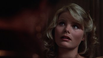 Movie still from “Star 80” (1983), directed by Bob Fosse – A woman with blonde hair and blue eyes looking up; Close Up shot, Over the shoulder angle