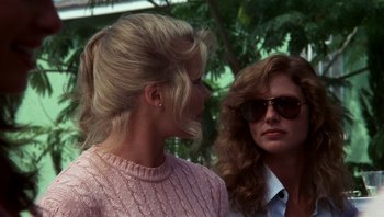 Movie still from “Star 80” (1983), directed by Bob Fosse – Two women wearing sunglasses and one is talking to another woman; Close Up shot, Over the shoulder angle