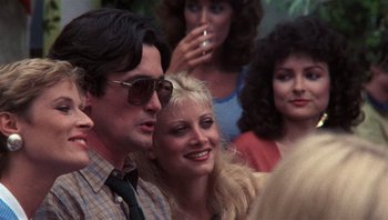 Movie still from “Star 80” (1983), directed by Bob Fosse – A man and a woman are standing next to each other; Close Up shot, Over the shoulder angle