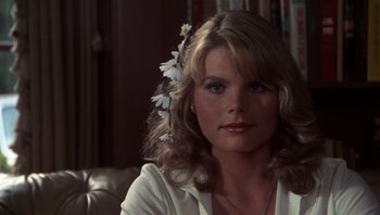 Movie still from “Star 80” (1983), directed by Bob Fosse – A woman sitting in front of a mirror with a flower in her hair; Close Up shot, Over the shoulder angle