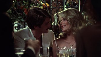 Movie still from “Star 80” (1983), directed by Bob Fosse – A man and a woman sitting at a dinner table; Close Up shot, Over the shoulder angle