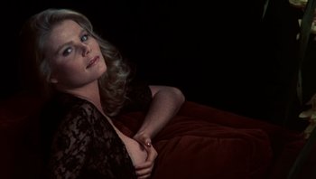 Movie still from “Star 80” (1983), directed by Bob Fosse – A woman laying on a bed with her hand on her chest; Close Up shot, Low angle