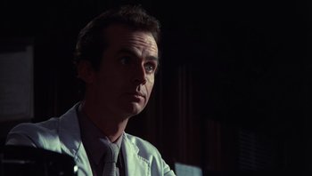 Movie still from “Star 80” (1983), directed by Bob Fosse – A person wearing a white lab coat; Close Up shot, Low angle