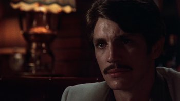 Movie still from “Star 80” (1983), directed by Bob Fosse – A person with a mustache; Close Up shot, Low angle