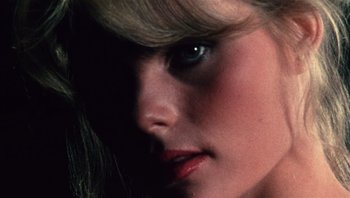 Movie still from “Star 80” (1983), directed by Bob Fosse – The face of a woman with long blonde hair; Extreme Close Up shot, Overhead angle