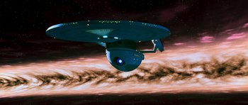 Movie still from “Star Trek VI: The Undiscovered Country” (1991), directed by Nicholas Meyer – A star trek ship in the middle of the night sky; Extreme Wide shot, Low angle