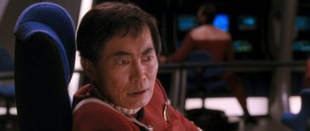 Movie still from “Star Trek VI: The Undiscovered Country” (1991), directed by Nicholas Meyer – A person sitting in a chair; Close Up shot, Over the shoulder angle