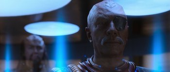 Movie still from “Star Trek VI: The Undiscovered Country” (1991), directed by Nicholas Meyer – An image of a man in a space suit looking at the camera; Close Up shot, Over the shoulder angle