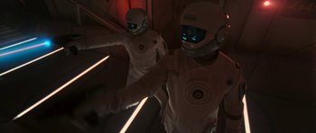 Movie still from “Star Trek VI: The Undiscovered Country” (1991), directed by Nicholas Meyer – Two people in spacesuits walking down a flight of stairs; Medium shot, Over the shoulder angle