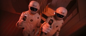 Movie still from “Star Trek VI: The Undiscovered Country” (1991), directed by Nicholas Meyer – A couple of men in white suits holding cell phones; Medium shot, Overhead angle