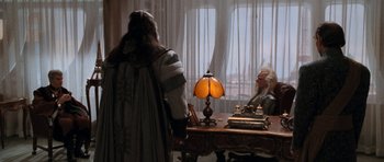 Movie still from “Star Trek VI: The Undiscovered Country” (1991), directed by Nicholas Meyer – Two people are sitting at a desk in a room; Wide shot, Over the shoulder angle