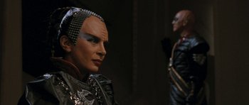 Movie still from “Star Trek VI: The Undiscovered Country” (1991), directed by Nicholas Meyer – A man in a costume and a woman in a costume; Close Up shot, Over the shoulder angle