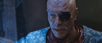 Movie still from “Star Trek VI: The Undiscovered Country” (1991), directed by Nicholas Meyer – A person wearing a costume; Close Up shot, Over the shoulder angle