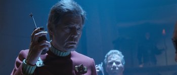 Movie still from “Star Trek VI: The Undiscovered Country” (1991), directed by Nicholas Meyer – A man in a red shirt and a man in a purple shirt; Medium shot, Over the shoulder angle