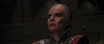 Movie still from “Star Trek VI: The Undiscovered Country” (1991), directed by Nicholas Meyer – A person wearing a costume; Close Up shot, Over the shoulder angle